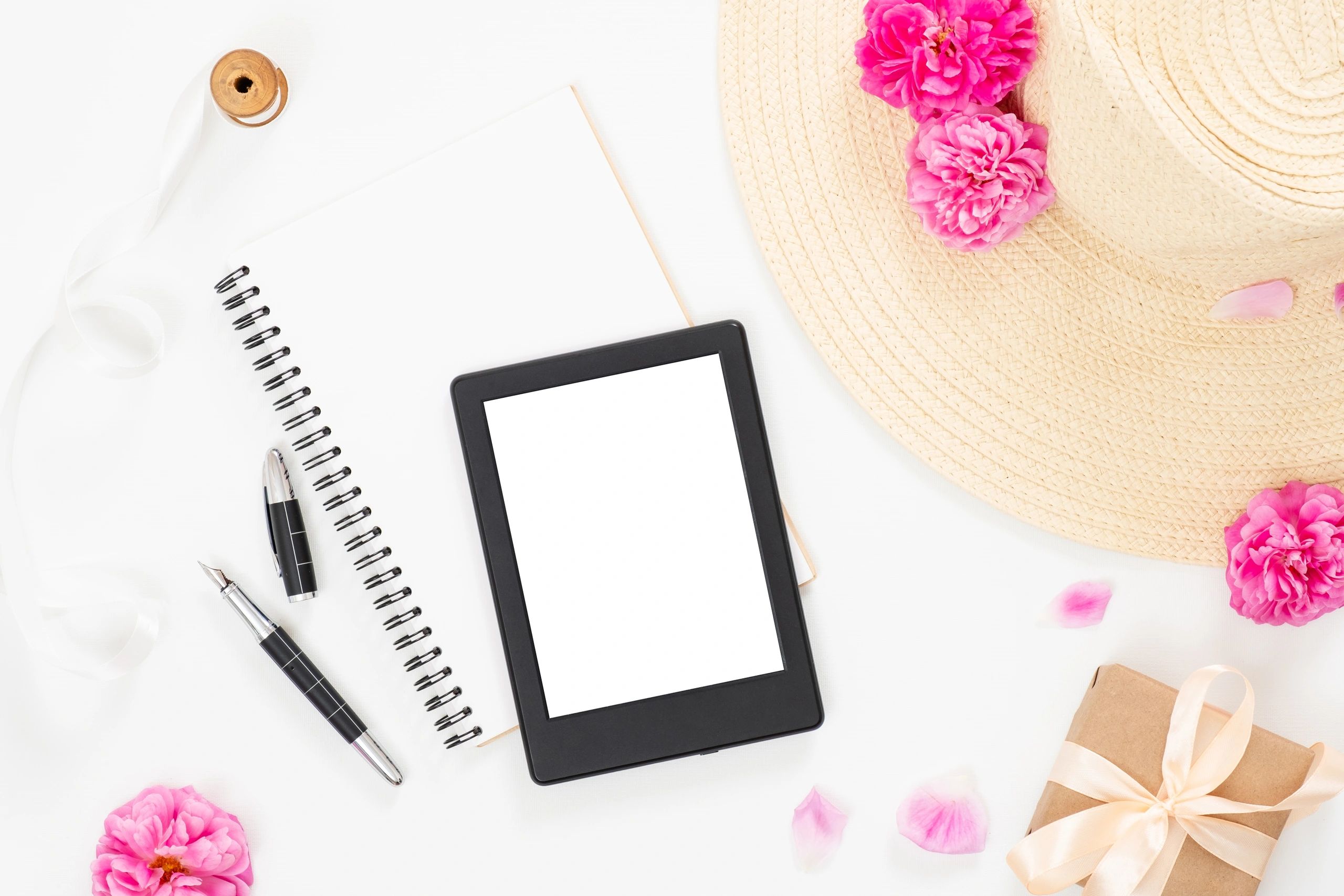 Flat lay workspace with tablet and journal representing digital downloads