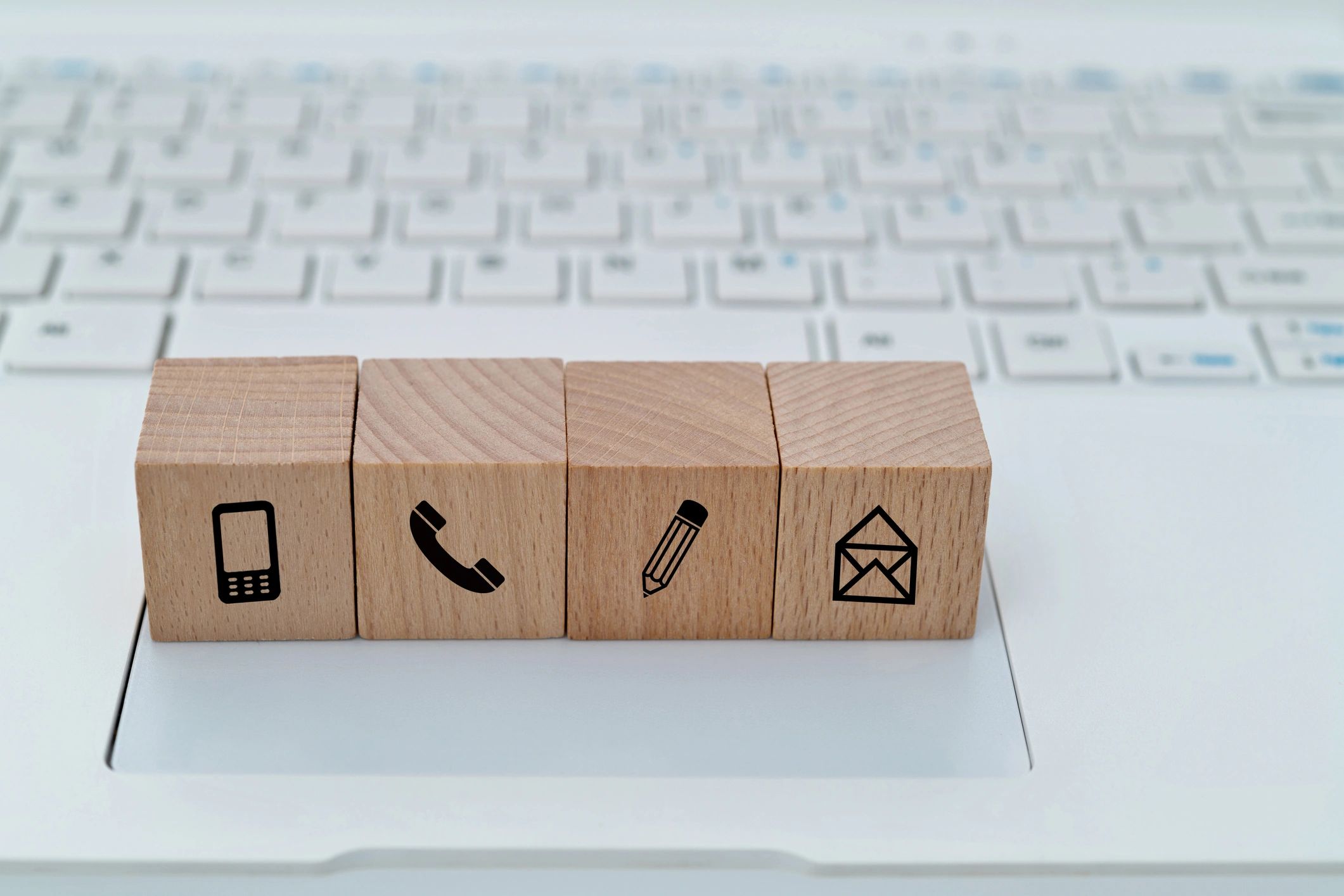 Contact us icons on a laptop keyboard